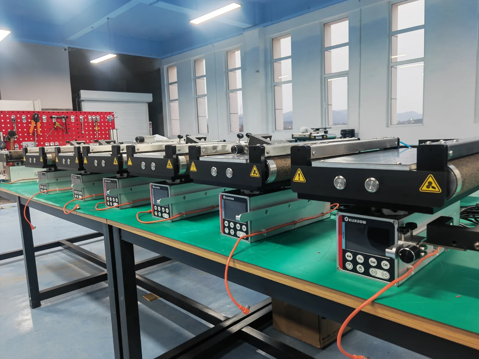 Integrated web guide frames being assembled and tested on a workbench